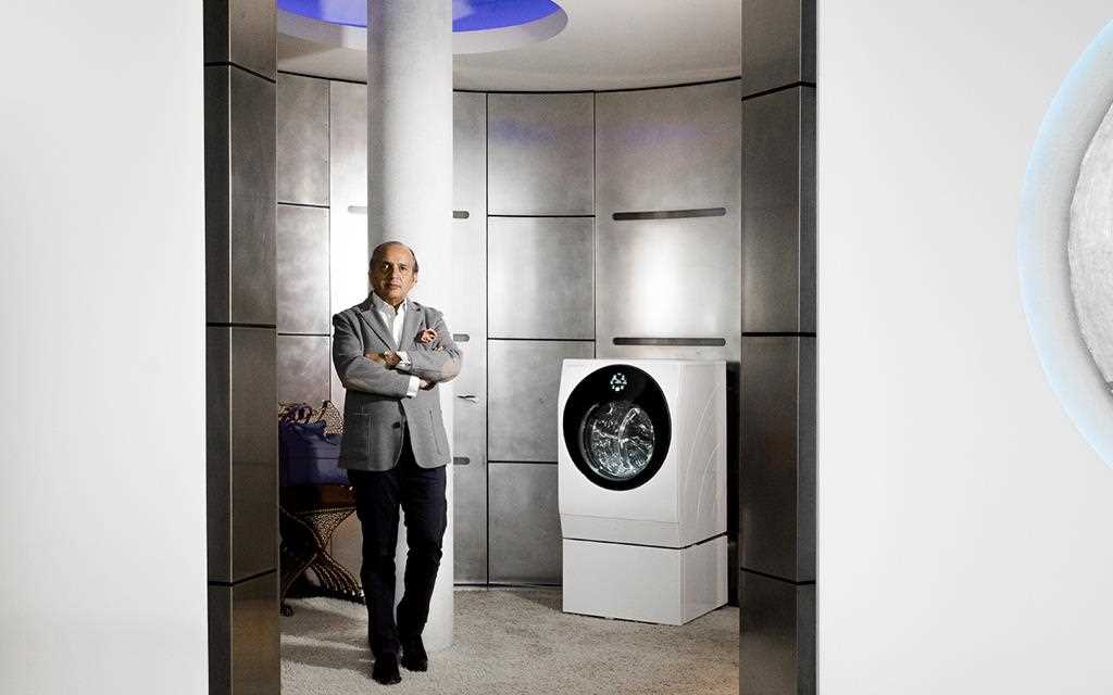 A TWINWash washing machine and a man in his luxurious and stunning laundry