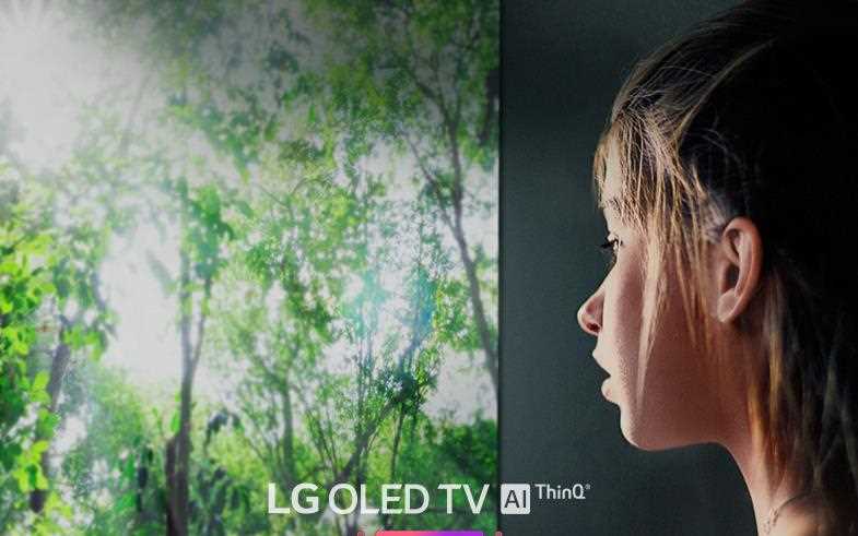A close-up of a girl's face, watching an LG OLED TV with Artificial Intelligence (AI) ThinQ capabilities