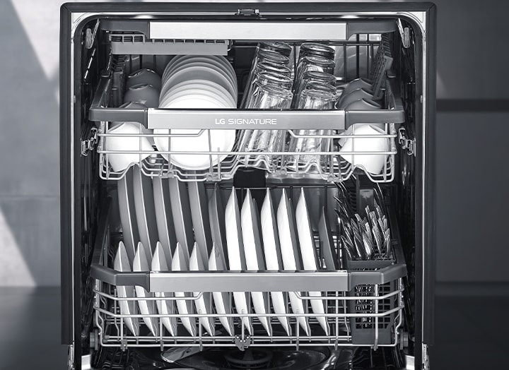 A lots of white dishes are placed on the each rack of LG SIGNATURE Dishwasher.