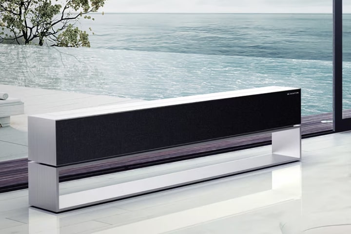 An image of LG SIGNATURE Rollable OLED TV in zero view located in a grey-colored space.