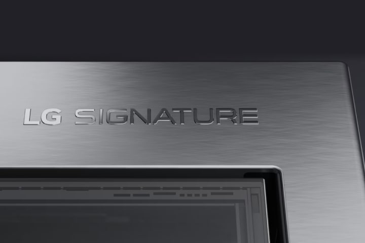 A close-up of the textured steel exterior finish and raised LG SIGNATURE logo.