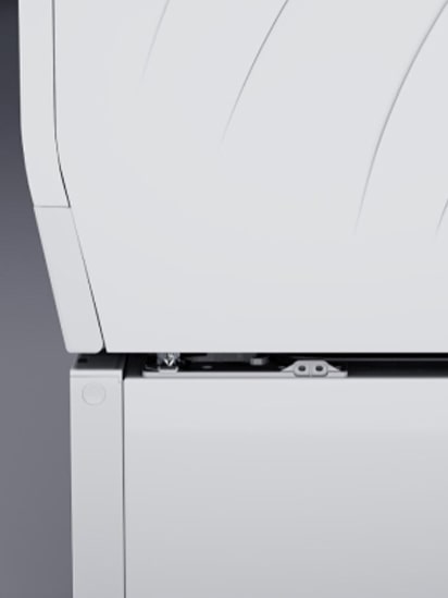 Image showing the top right section of the LG Signature Washing Machine. Part of the machine door, Quick Circle Display panel, and detailed white enamel body are shown.