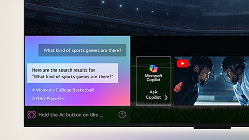 LG OLED TV screen showing how AI Search works. A small chat window is open showing how the user asked for what sports games are available. AI search responded via chat and by showing thumbnails of different available content. There is also a prompt to ask Microsoft Copilot.