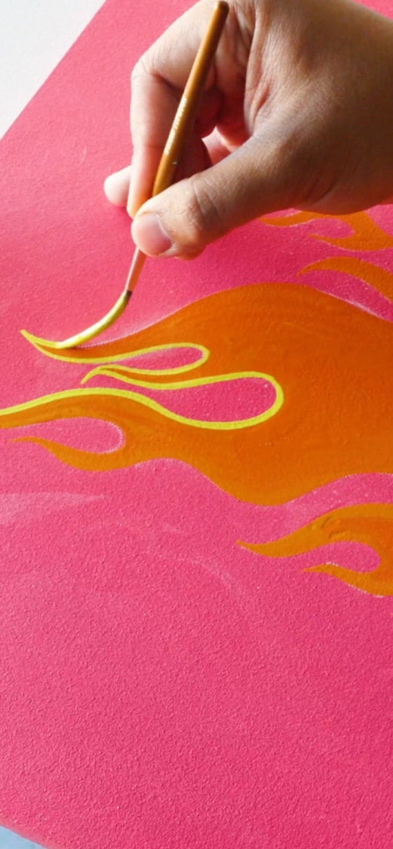 A hand delicately painting.