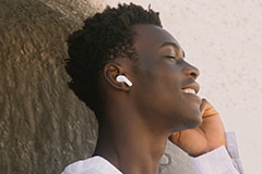 A man is listening music with LG TONE Free