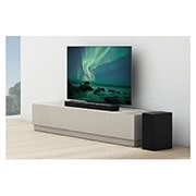 LG Barre de son 3.1.2 | 380W | Dolby Atmos | DTS:X | eARC | Hi-Res Audio, Une barre de son et un téléviseur sont posés sur une étagère beige, haut-parleur arrière placé juste à côté, S75Q, thumbnail 13