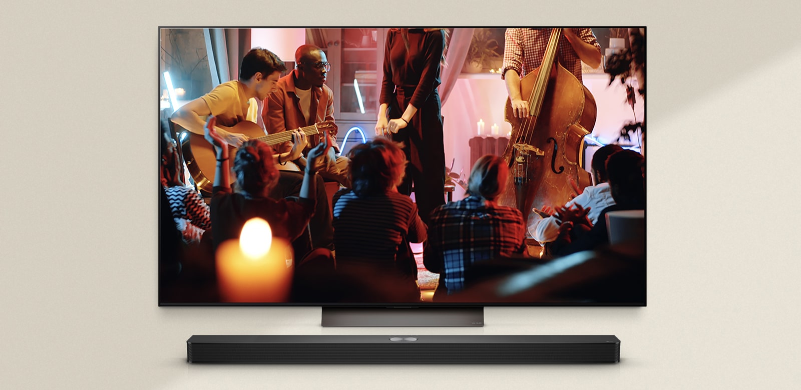 A cozy concert in a living room is playing on the screen. The WOW Interface menu appears as an overlay and the user navigates to soundbar settings. 