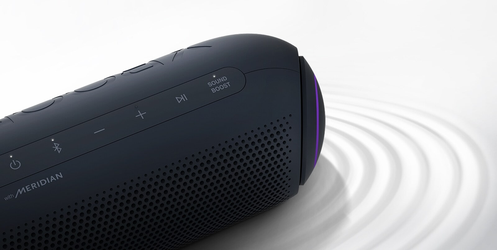 On a white background, LG XBOOM Go faces the upper right with purple lighting, there is a ripple effect under the product.