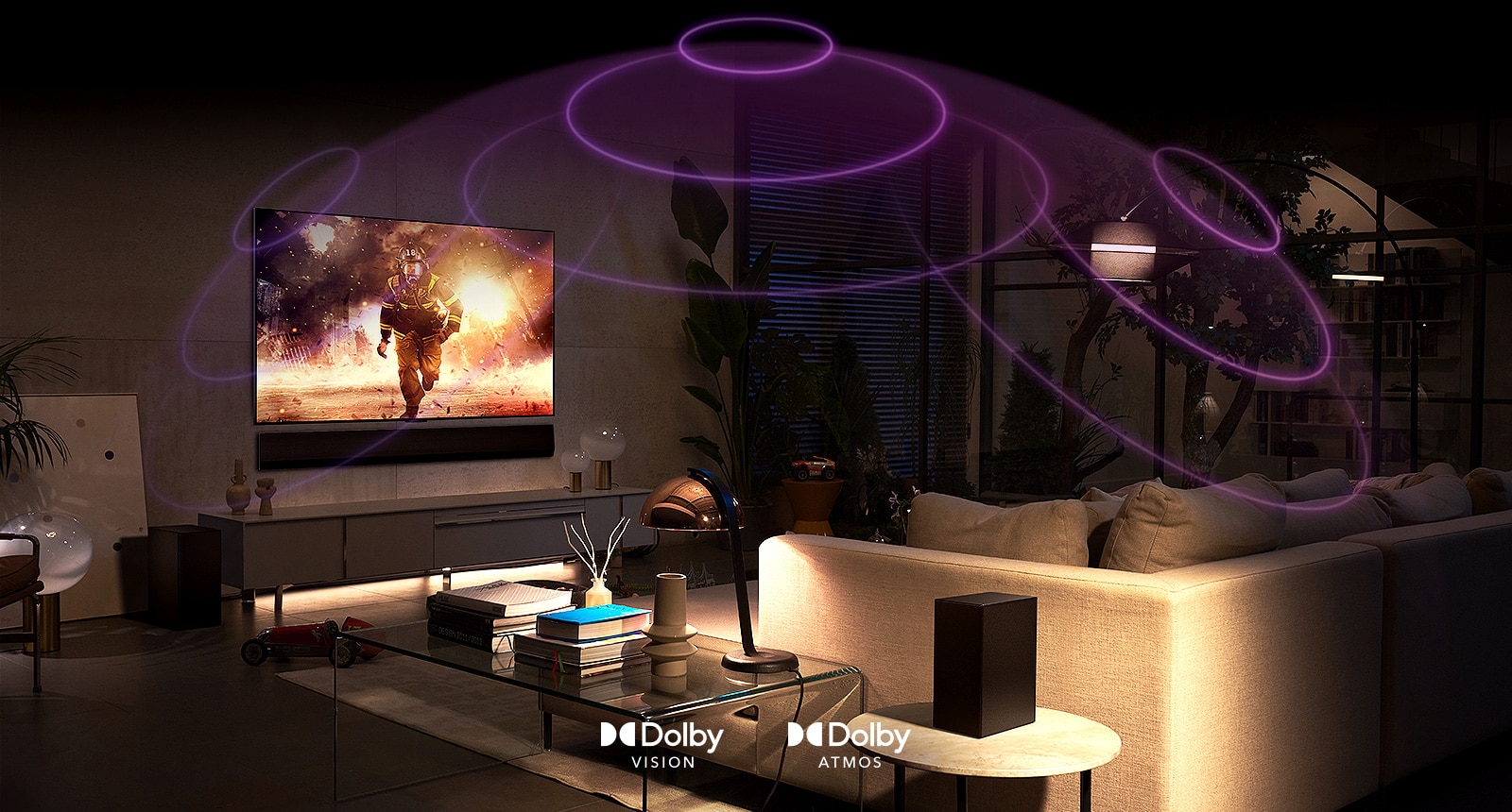 Photo of LG OLED TV in a room showing an action movie.  Sound waves create a kiss-like shape between the sofa and the TV for immersive spatial sound perception.