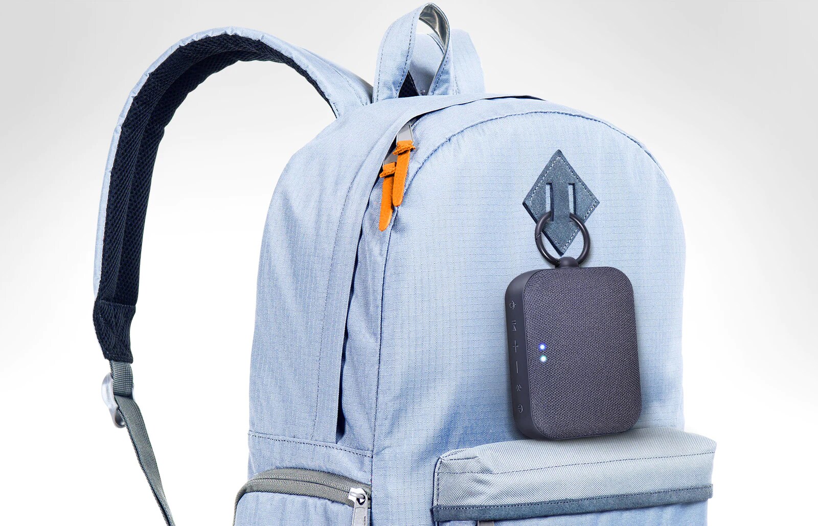 The LG XBOOM Go PN1 is enclosed in a sky blue backpack.