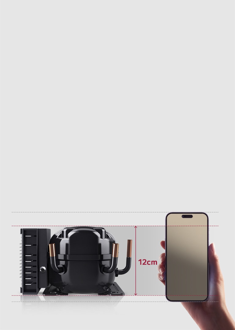 LG reciprocating compressor unit next to a smartphone held upright in a hand, showing a size comparison.