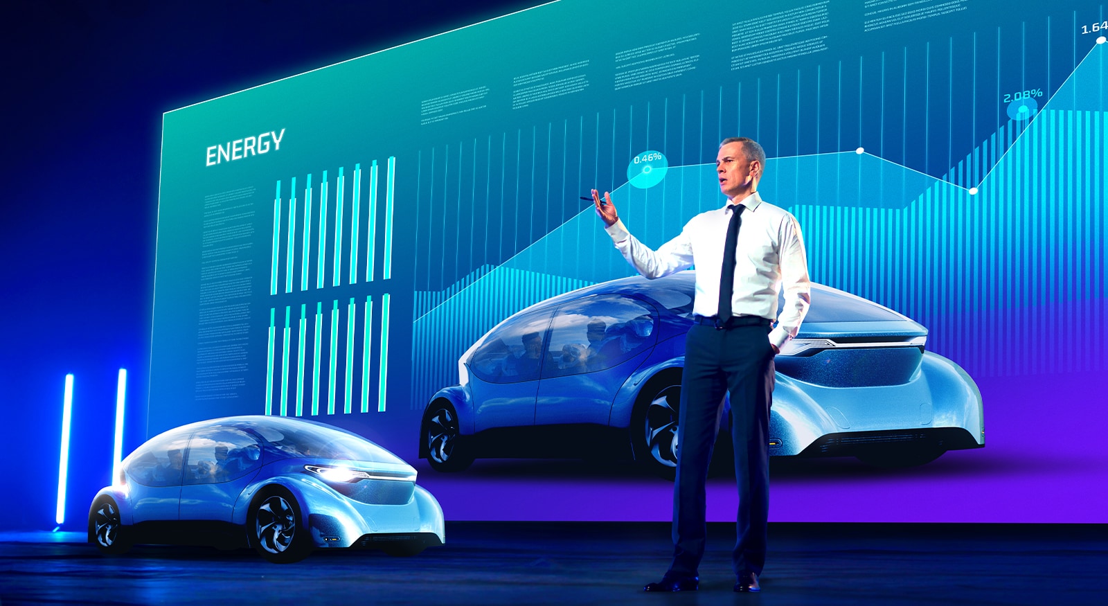 A man is giving a presentation in front of a large LED screen. The screen displays automobile-related content with clear visibility.