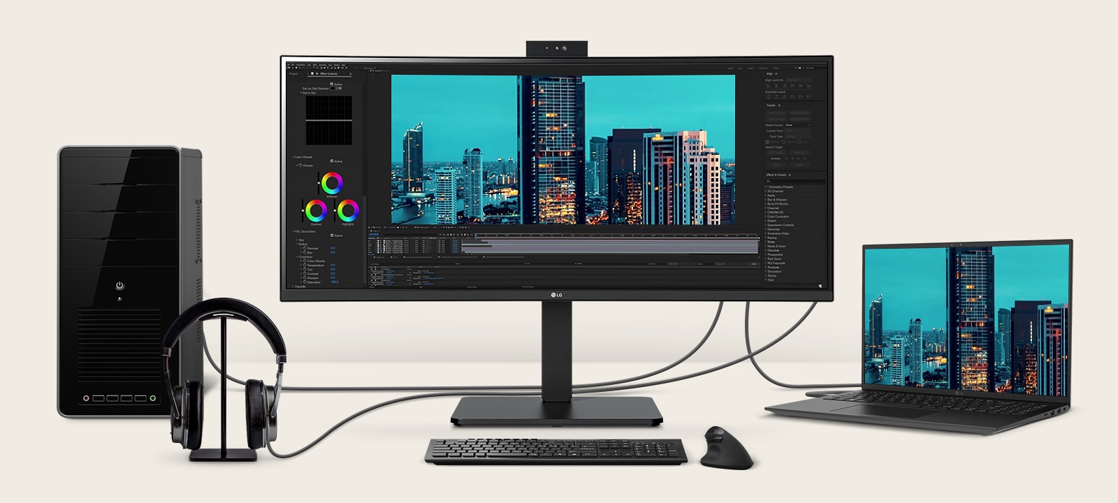 Front view showing a workstation with multiple devices connected to monitors.	