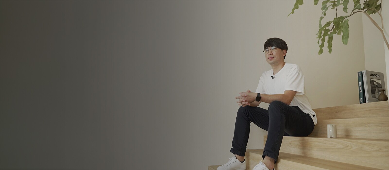 An image of an researcher sitting on the stairs