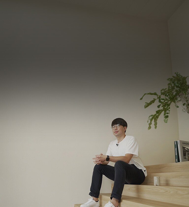 An image of an researcher sitting on the stairs