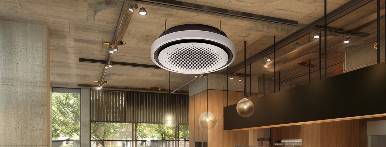 The LG Round Cassette is elegantly displayed in a modern office space, featuring its distinct round design that blends seamlessly with contemporary wooden and concrete interior aesthetics.