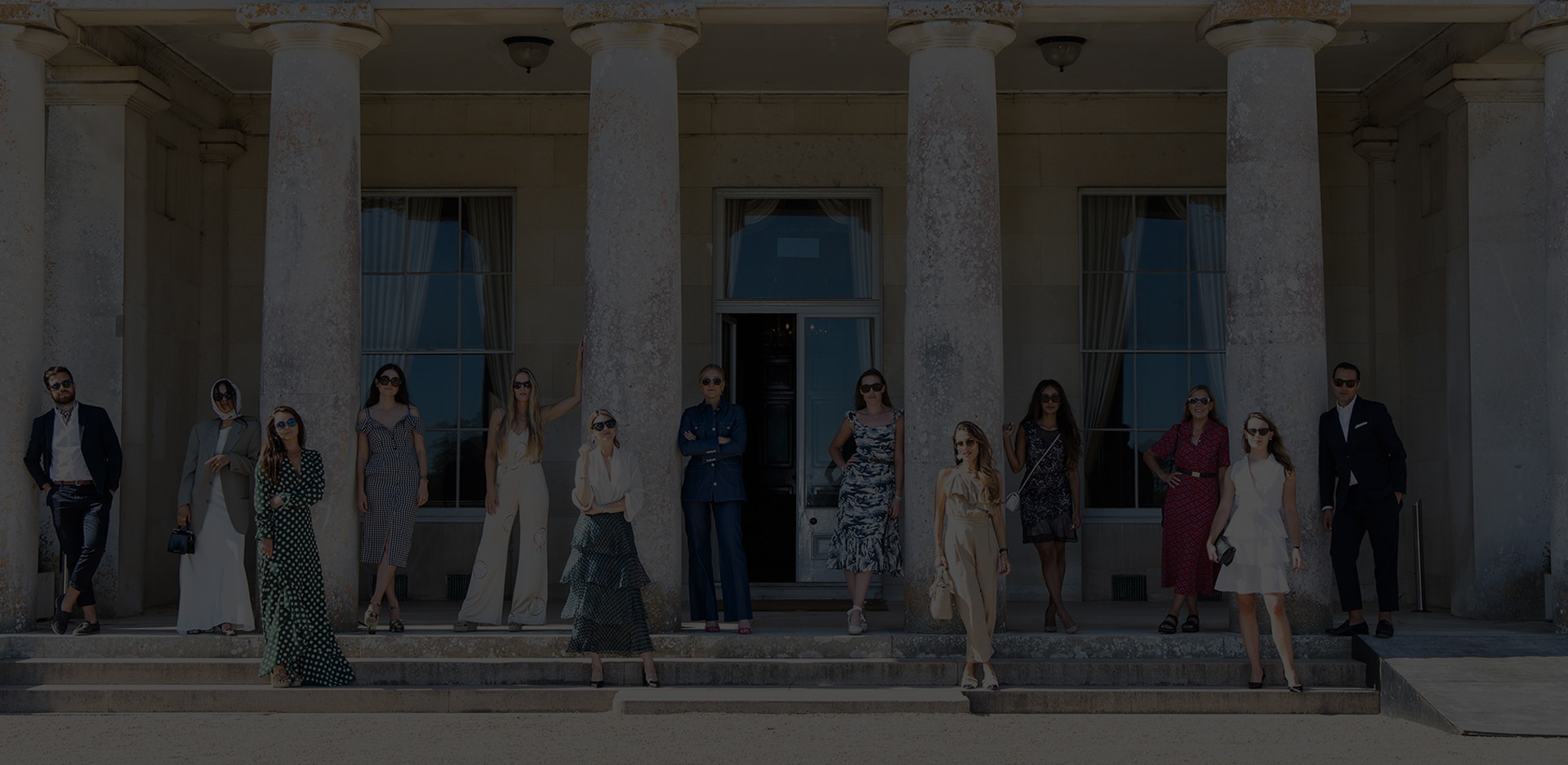 Stylish models try to recreate an iconic photo from the 1800s on the front steps of Goodwood House.