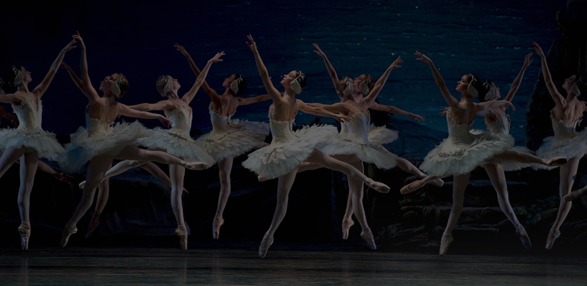 An woman is dancing ballet on the stage