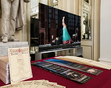LG SIGNATURE 8K OLED TV playing the opera performance on its screen is displayed at La Scala opera house.