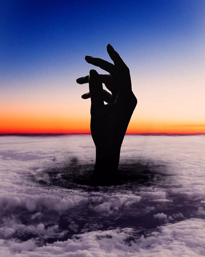 The large silhouette of a hand in front of a beach at sunset morphing into different abstract shapes