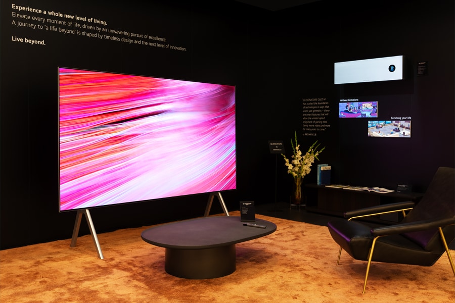 The OLED M and accompanying furniture is showcased as part of an exhibition.