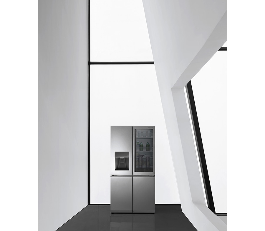 a black and white image of lg signature refrigerator which is hung on the wall