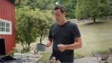 Thumbnail of a man cooking outdoors. (play the video)