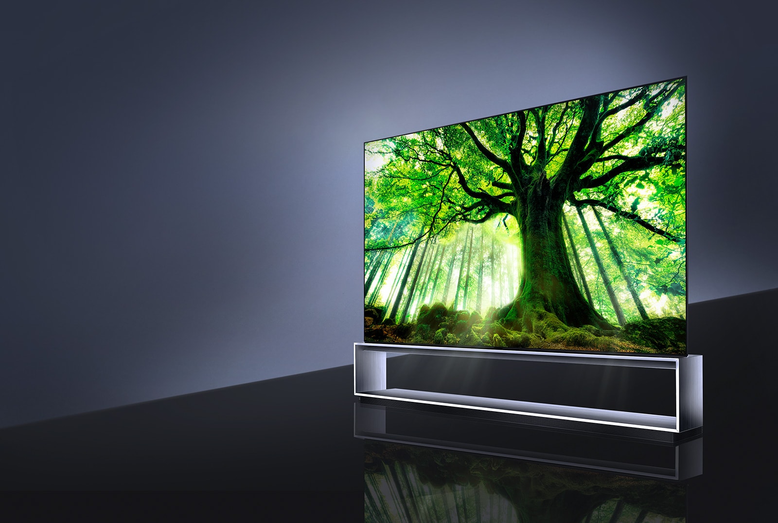Side view of LG SIGNATURE OLED TV Z9 with the screen filled with a big tree