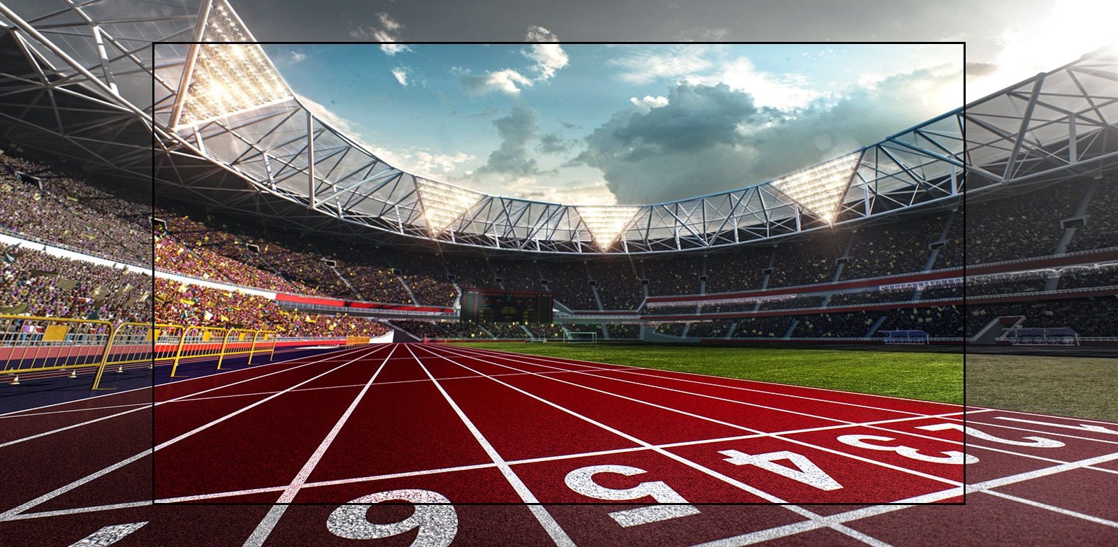 Uno schermo TV che mostra lo stadio con una vista ravvicinata della pista.  Lo stadio è pieno di spettatori.