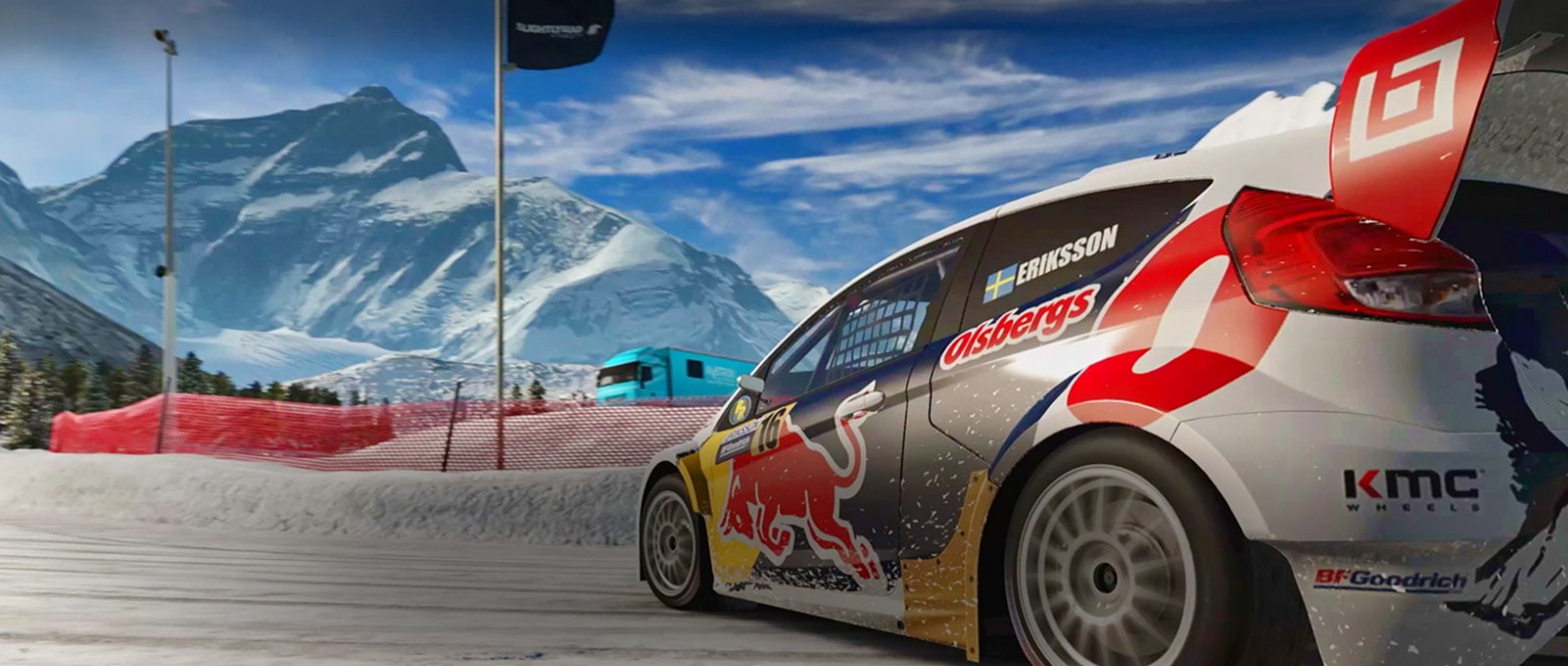 A scene from a racing game. A car is going round a corner of a snow covered circuit.