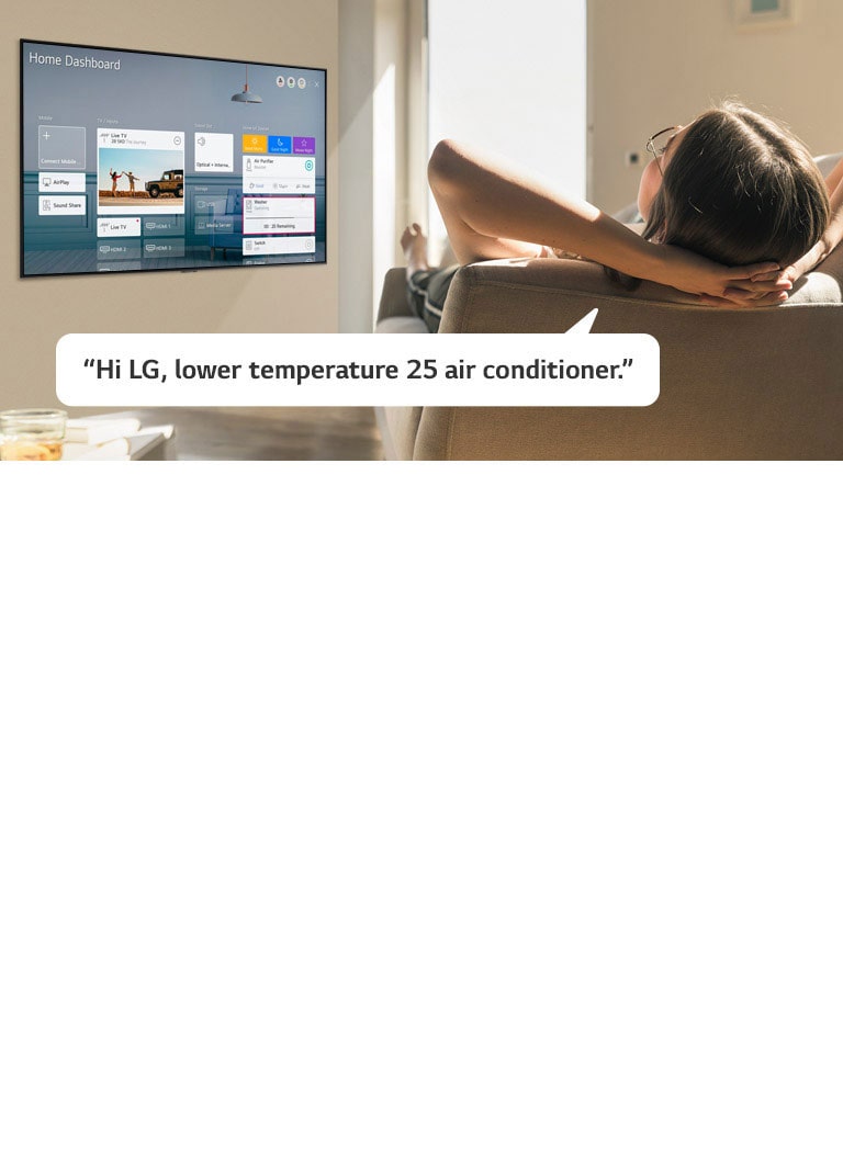 Woman lying on a sofa telling TV to lower the temperature with Home Dashboard on the TV screen
