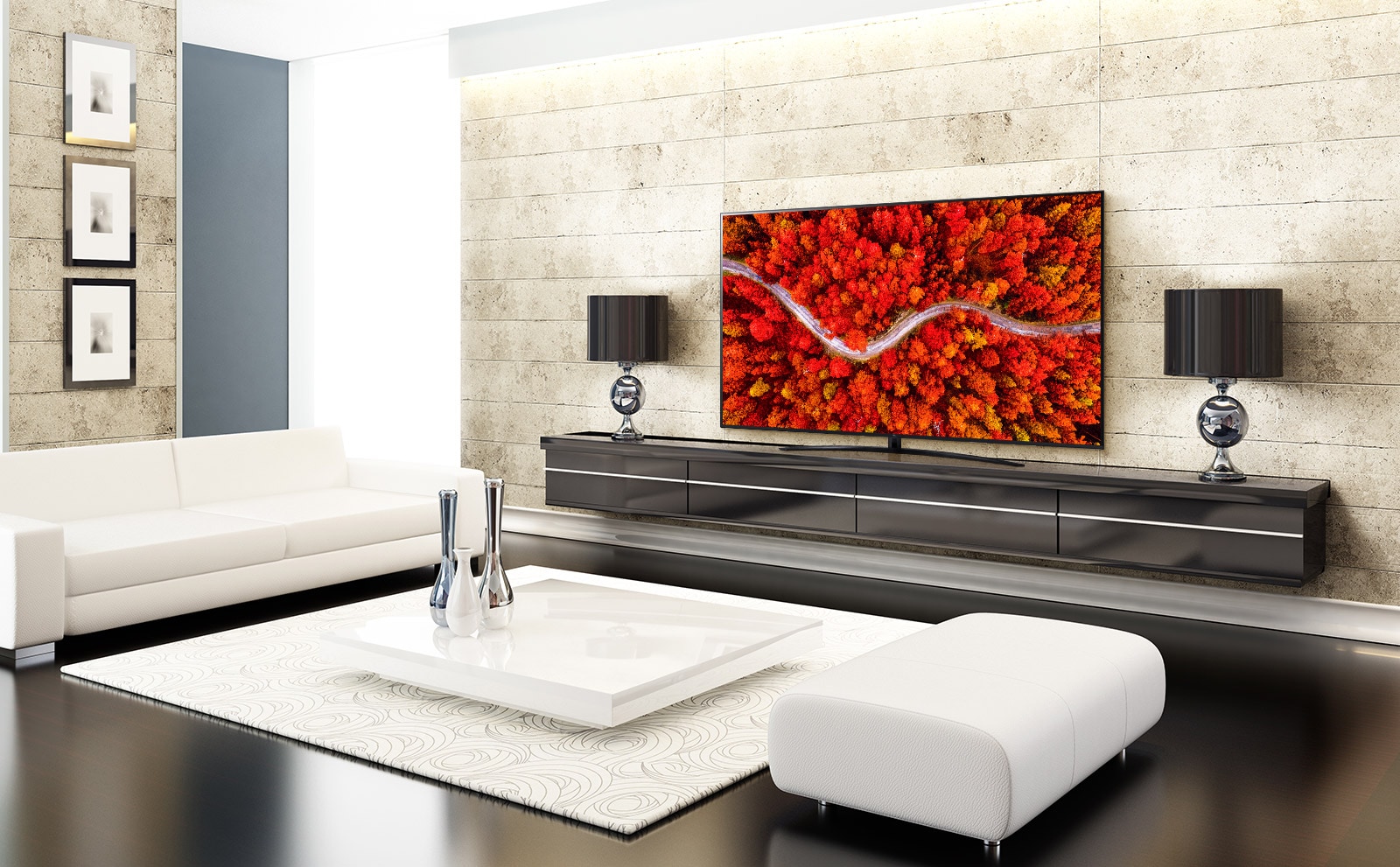 A luxury living room with a TV displaying an aerial view of woods in red.