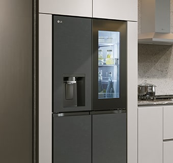 Modern kitchen interior with InstaView fridge.