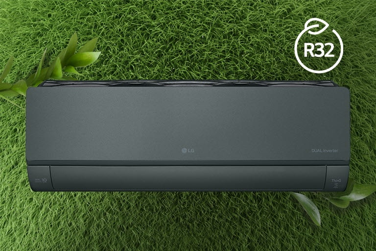 The LG Air conditioner is installed on a wall of grass. The R32 logo for energy efficiency is in the upper right corner.