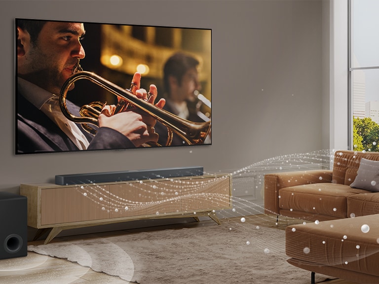 An LG Soundbar, LG TV, and subwoofer are in a modern city apartment. The LG Soundbar emits three branches of soundwaves, made of white droplets that float along the bottom of the floor. Next to the Soundbar is a subwoofer, creating a sound effect from the bottom.