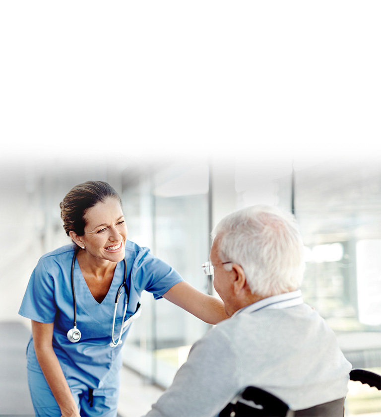 An image of a nurse smiling to a patient.