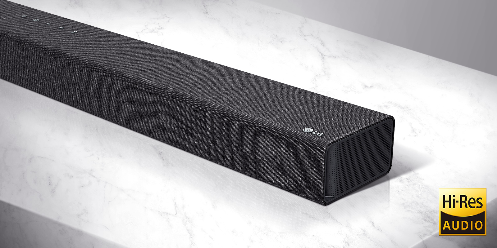 Close-up of LG Soundbar right side with LG logo on the bottom right corner of a product.