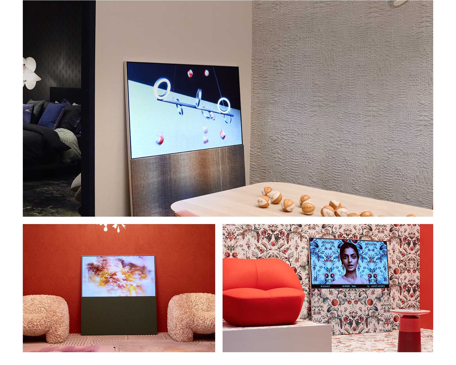 The top image shows Easel leaning against a wall in a neutral-colored room showing an abstract artwork featuring baseballs on the screen. Across from the TV sits a wooden table that also has baseballs on it. 	 The bottom right image shows Easel leaning against a bright floral patterned wall with a red and green color scheme. A picture of a woman against the same background as the surrounding wall is on the screen. The fabric textured stand also has the same pattern. Beside the TV, there is a red one-person sofa. The bottom left image shows Easel leaning against a textured terracotta-colored wall. An abstract red, orange, and purple image fills the screen. On either side of the TV, there are beige, textured one-person sofas.