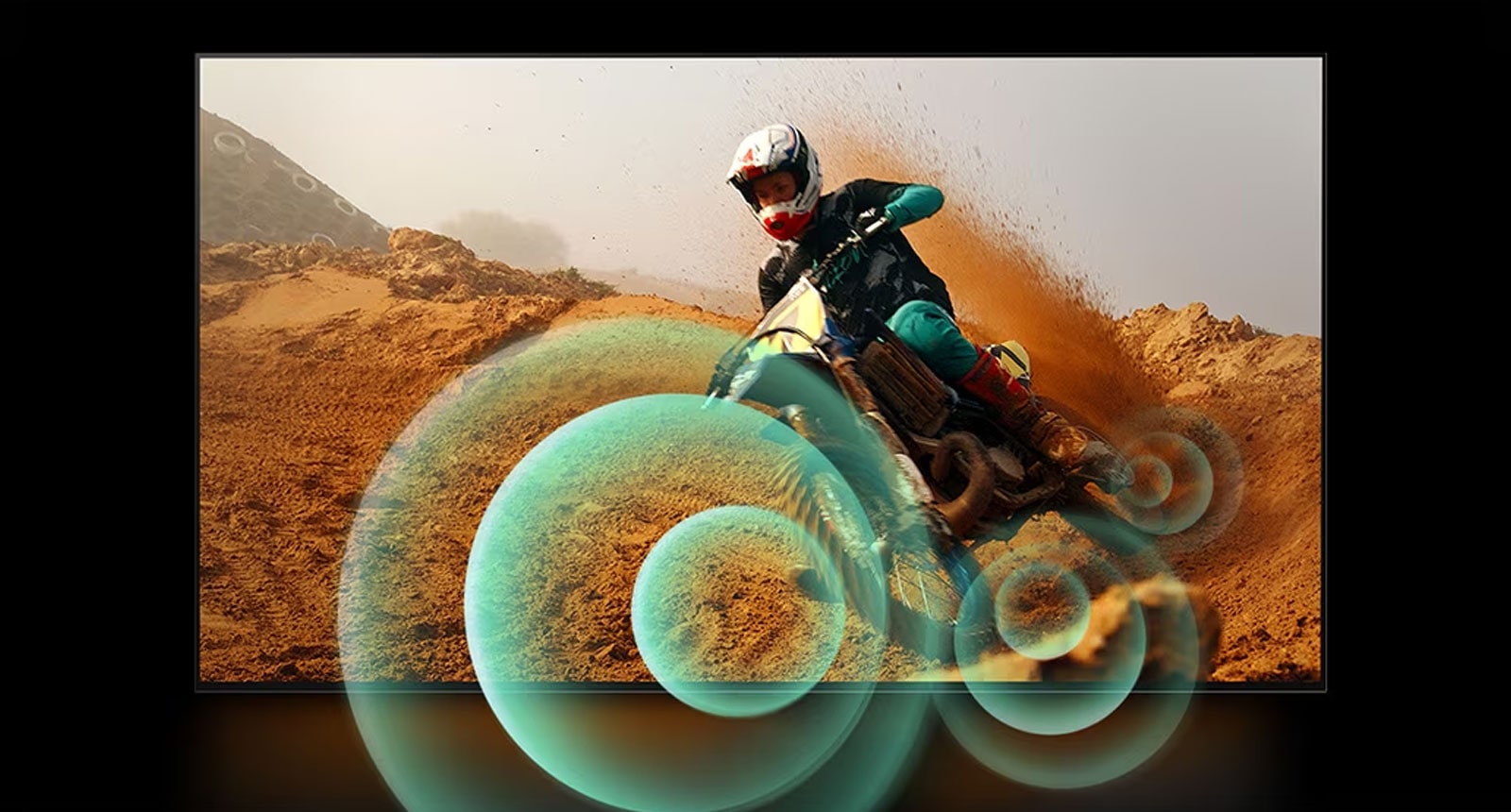 An image of a man riding a motorbike on a dirt track with bright circle graphics around the motorbike.