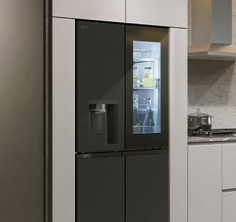 Modern kitchen interior with InstaView fridge.