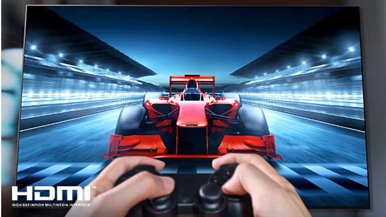 A close up of a player playing a racing game on a TV screen. On the image, there are HDMI logo on the bottom left.