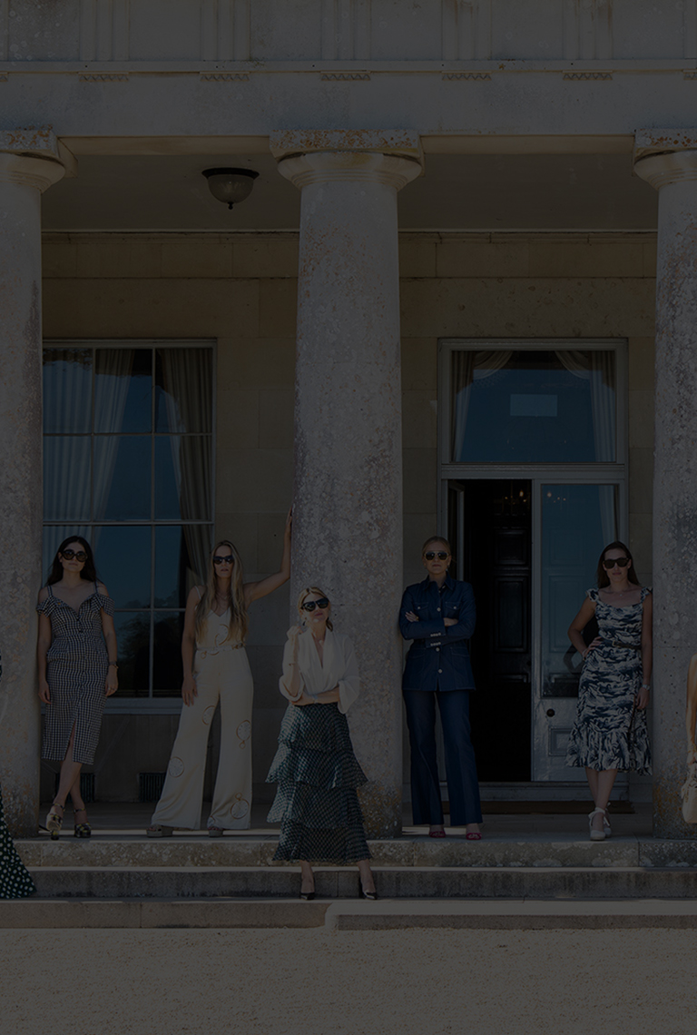 Stylish models try to recreate an iconic photo from the 1800s on the front steps of Goodwood House.