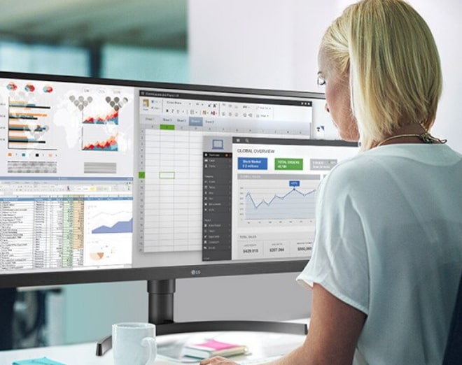 Woman looking at desktop computer