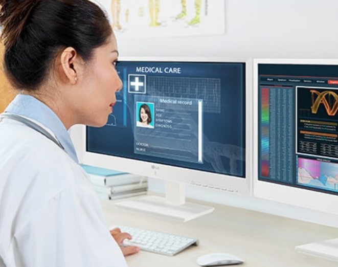 Woman looking at desktop computer