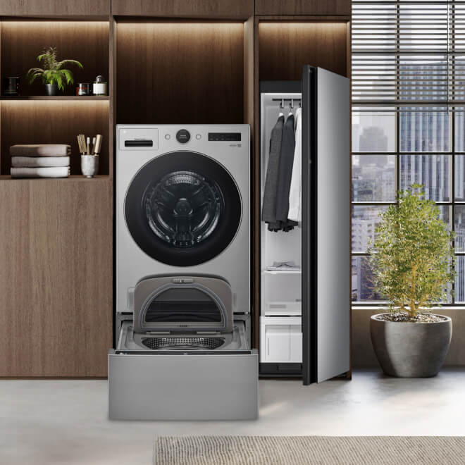 LG's Styler Steam Closet sits to the right of an all-in-one washer/dryer and Sidekick pedestal washer in a modern apartment.