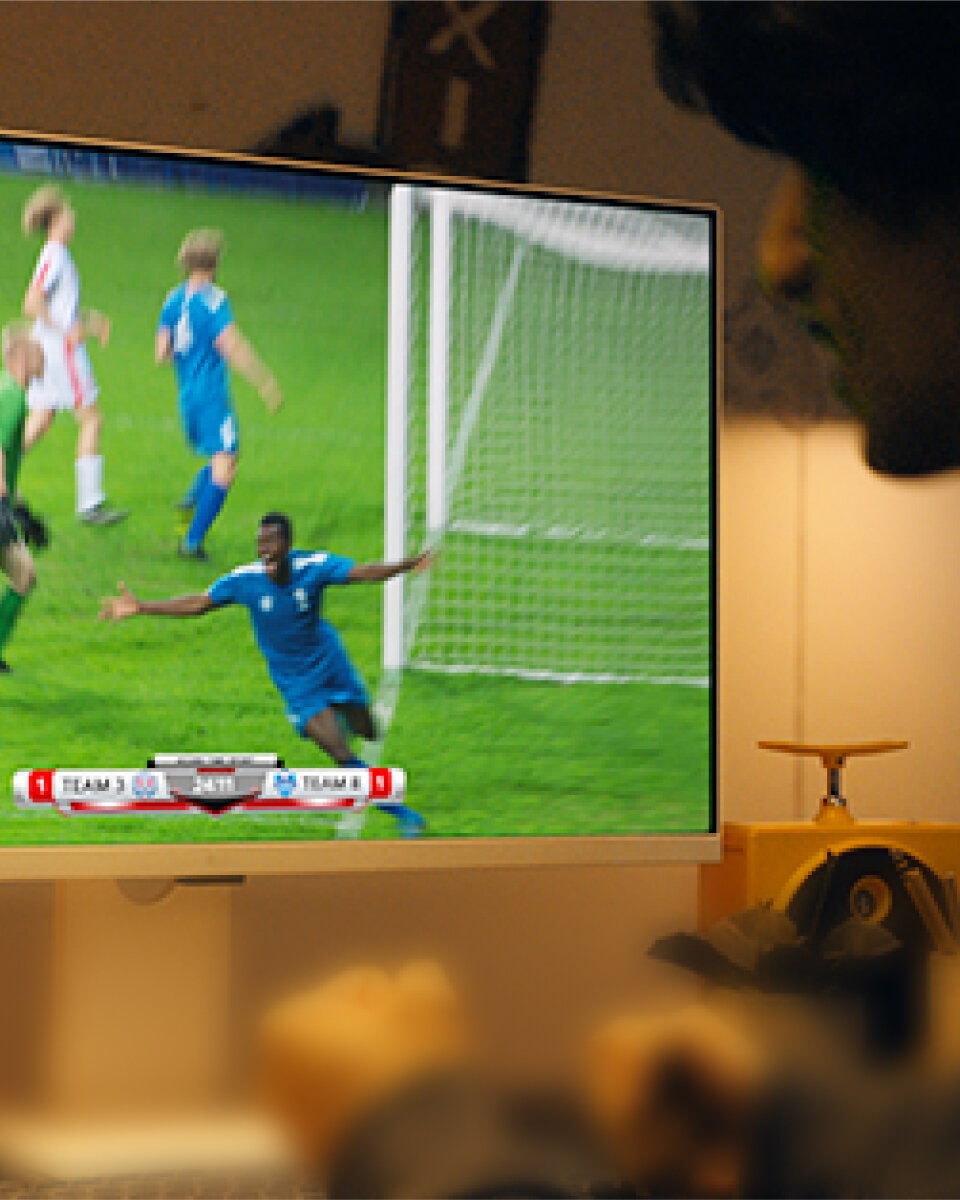 A soccer game is streamed on the LG MyView Monitor via LG Channels, showcasing the wide capabilities of the built-in webOS.