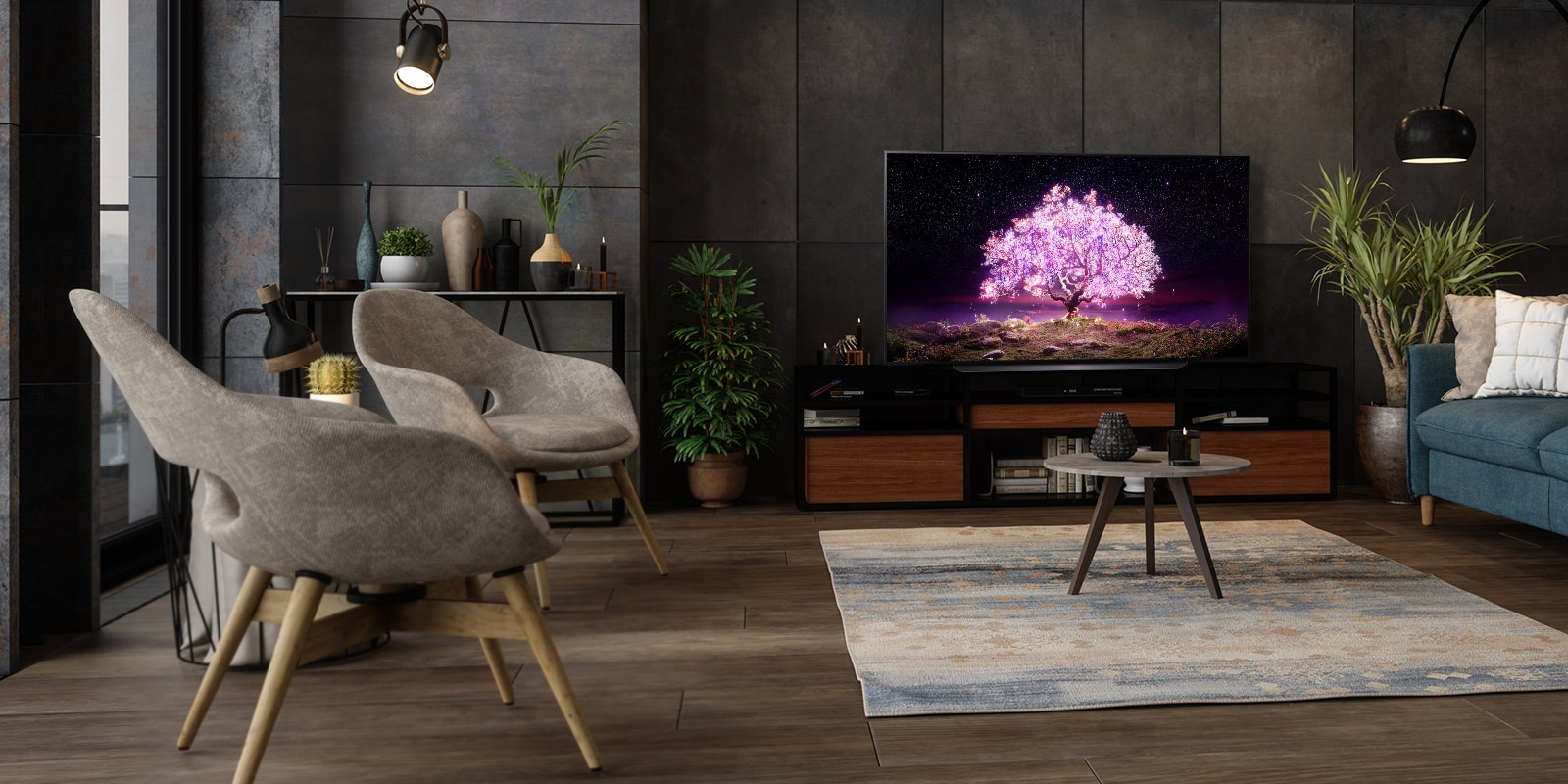 An OLED TV showing a tree emitting purple light in a luxurious house setting