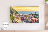 Luxury living room view of LG TV with village landscape on screen