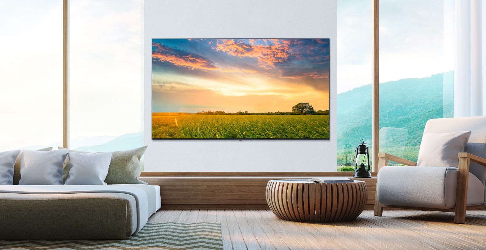 A TV is hanging on the wall of the hotel room, and the scenery shown on the TV screen is bright and clear.