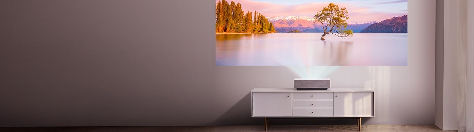 LG Projector projecting on a wall screen